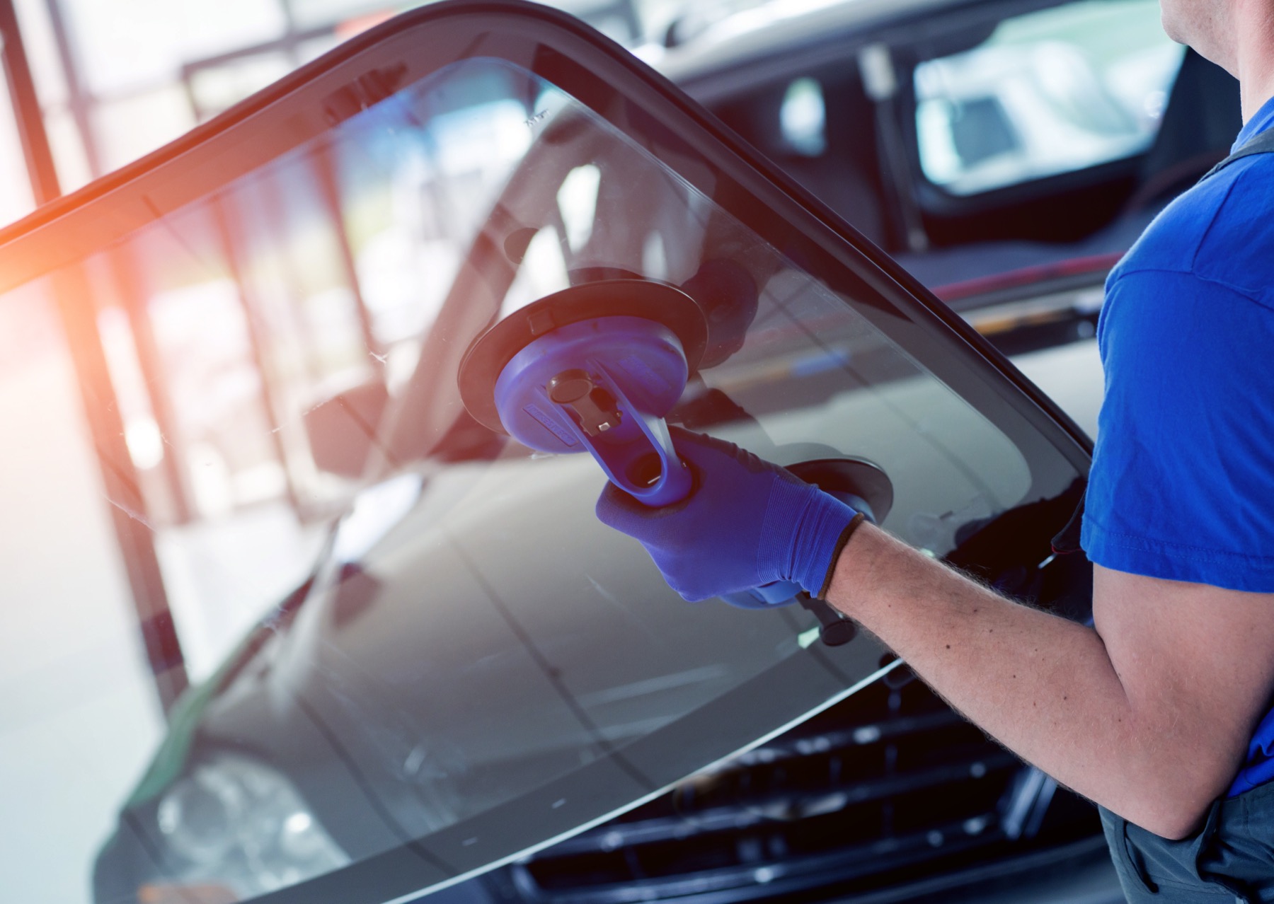 Westco Auto Glass technician removing a windshield